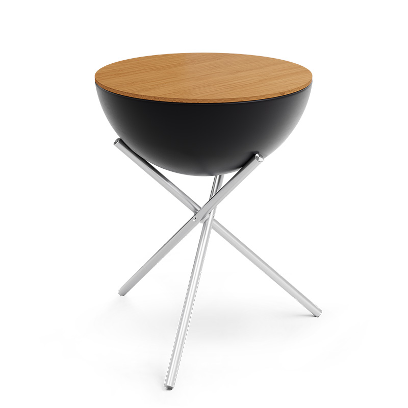 The photo presents a black and wood side table with a metal base, with the BOWL 70 Board.