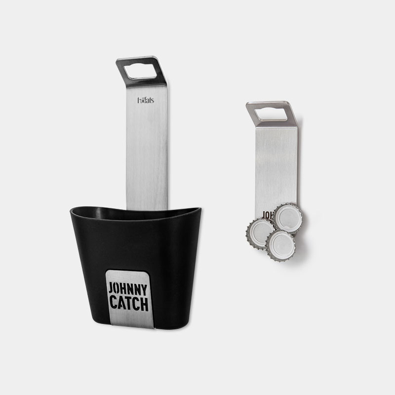 This image shows a black and white key holder with a keychai, with the JOHNNY CATCH Cup.