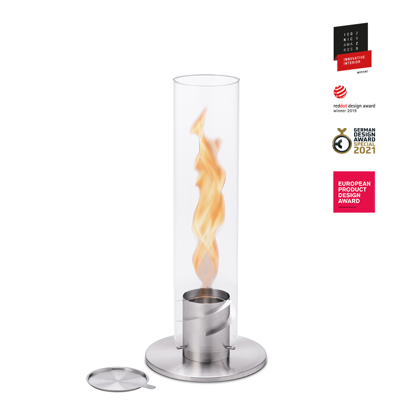 The photo presents a glass flame with a metal stand, with the SPIN 120 Table Fire silver.