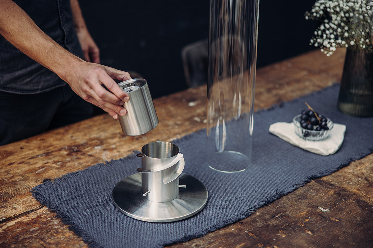 Experience a person pouring ethanol into the 00696 Spin 1200 Bio Burner