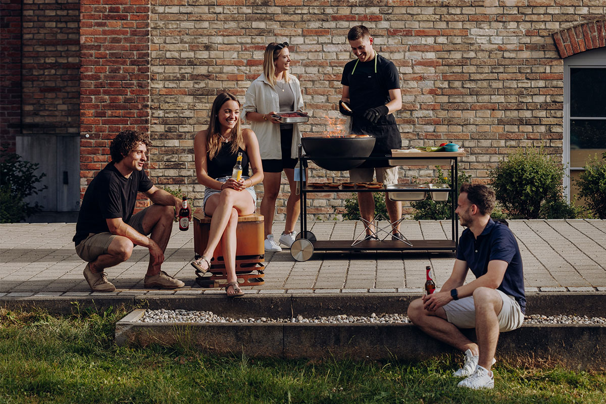 This image shows a group of people sitting on a bench