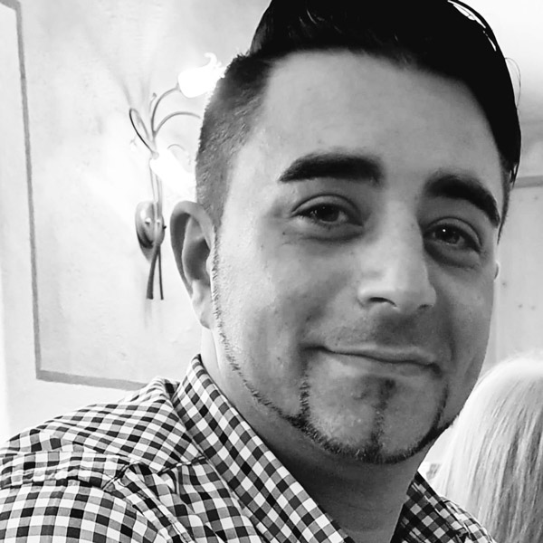 a man and woman are smiling for the camera.