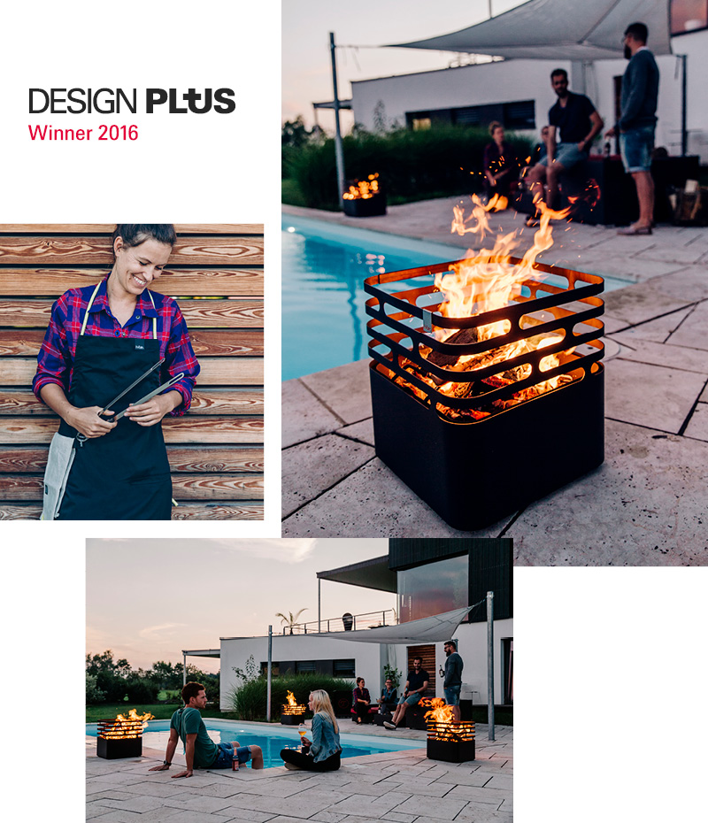 a man standing next to a fire pit