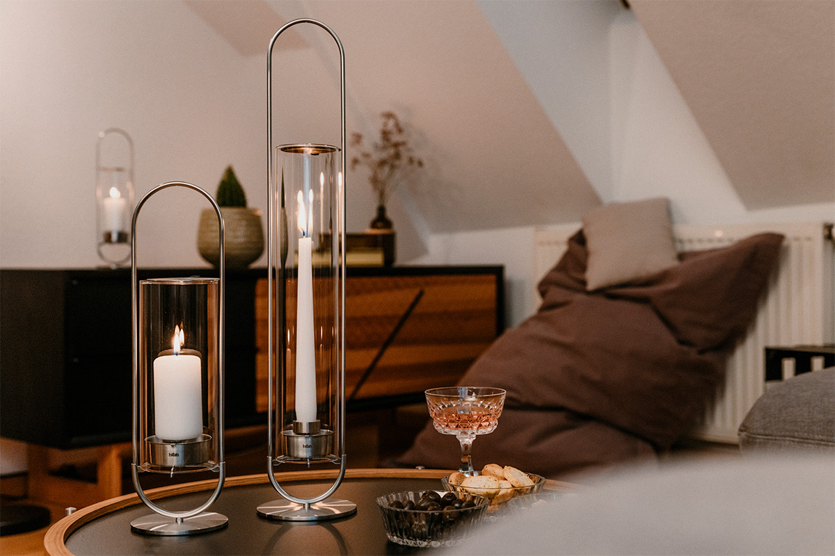 a table with a candle and a glass on it