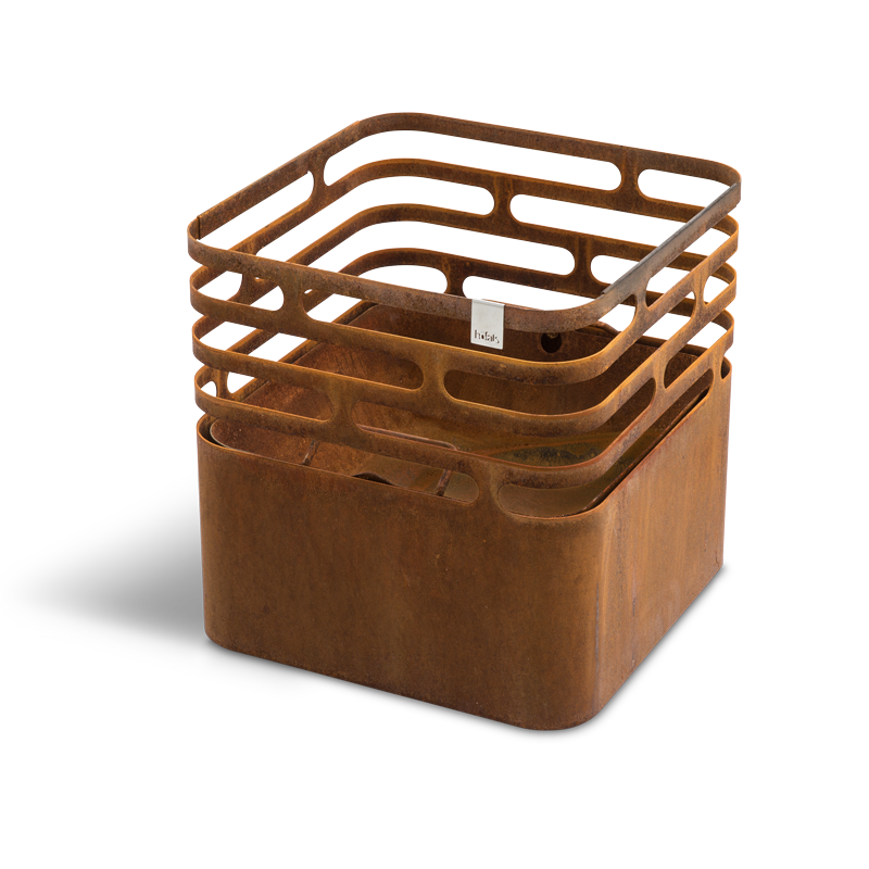 CUBE Fire Basket Corten Steel Scene showing a rusty metal cube with a handle, where the Cube Firebasket rusty stands out for its practical elegance.