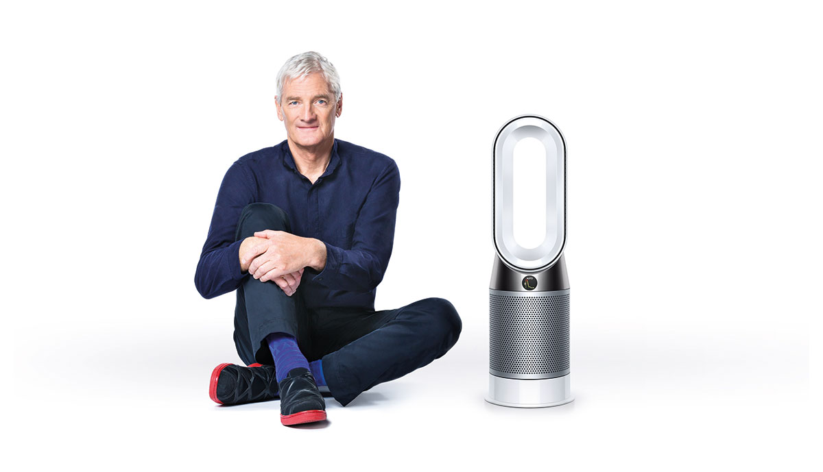 a man sitting on the floor next to an air pu.