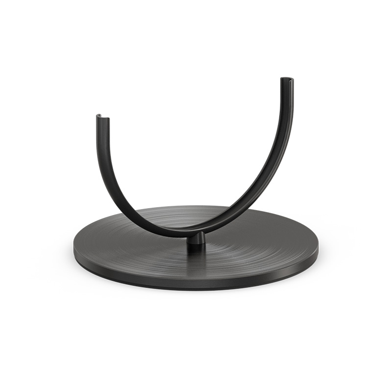 The 00275 Oval Candle 35 base black integrates seamlessly into the setting, where a black metal stand with a black base.