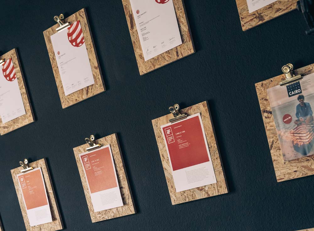 a wall with several different types of paper on it.