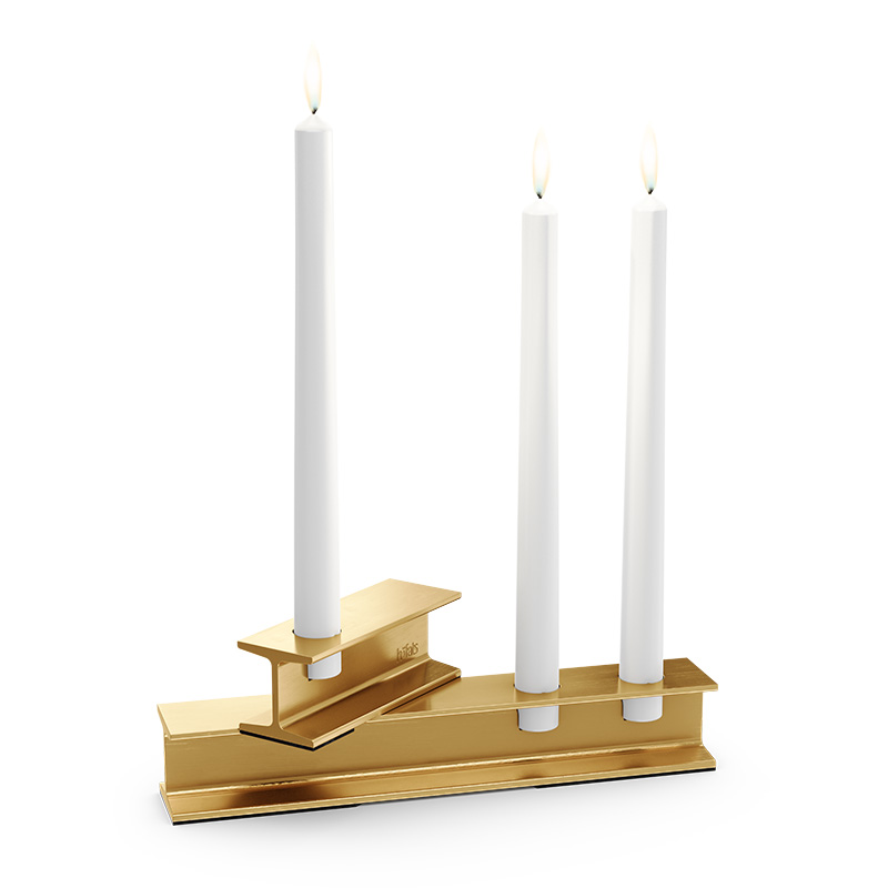 HENRY METAL II Candleholder gold The 00662 Henry Metal II Gold is shown as a gold candle holder with three candles on it, creating a stylish and accessible visual.