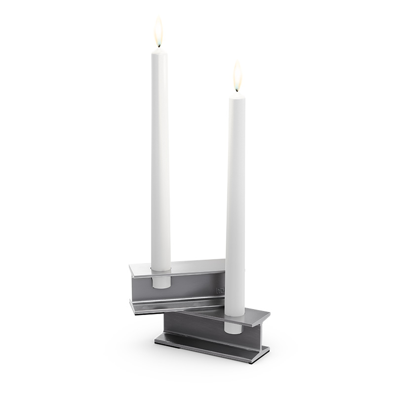 Experience a pair of candles sitting on top of a stand with the refined touch of the 00657 Henry Metal I silver