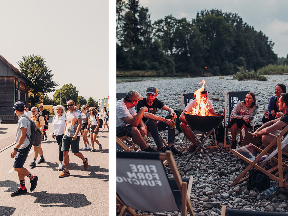 The photo presents a group of people sitting around a fire pit