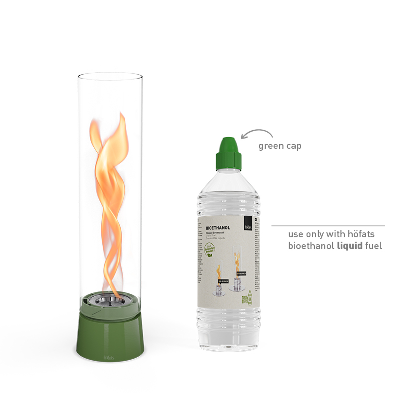 SPIN air 900 Tabletop Fireplace enamel green A bottle of bioethanol liquid and a fire in a SPIN Tablefire next to it the 00819 Spin Air 1200 Tablefire Emaille green complements the moment with its thoughtful design.