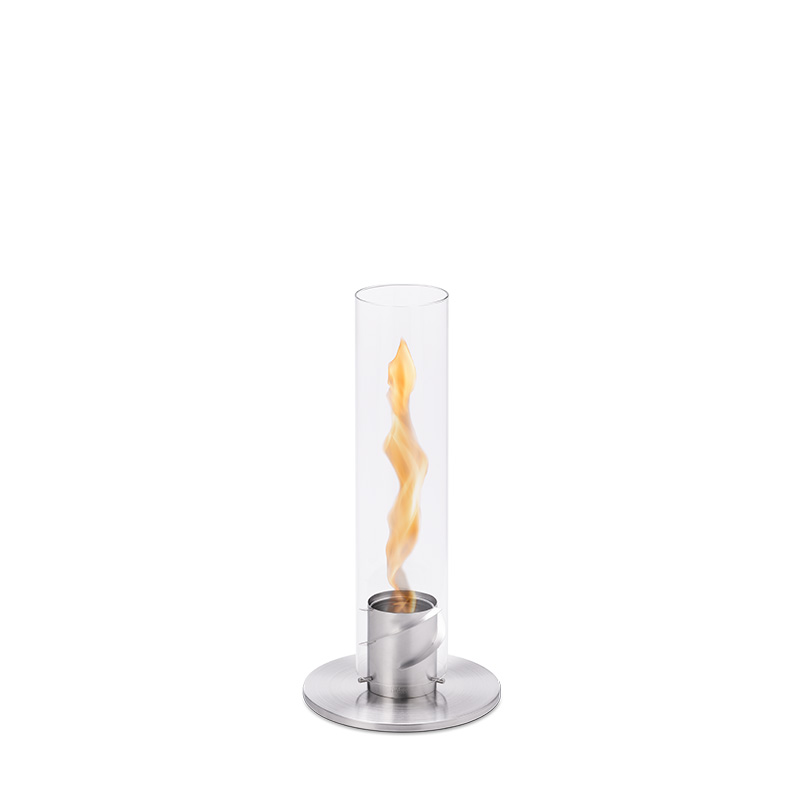 SPIN 90 Tabletop Fireplace silver A depiction of a glass flame with a metal stand, featuring the Spin 90 Tablefire silver as a central and purposeful element.